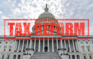 Pros and Cons of the New Tax Law, United States Capitol Building in Washington DC with Tax Reform stamp effect